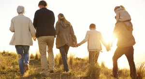 Shot of a happy family holding hands on a morning walk together